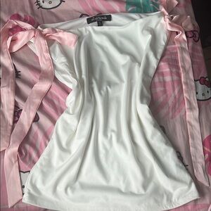 Elegant White Top with Pink Ribbon Details